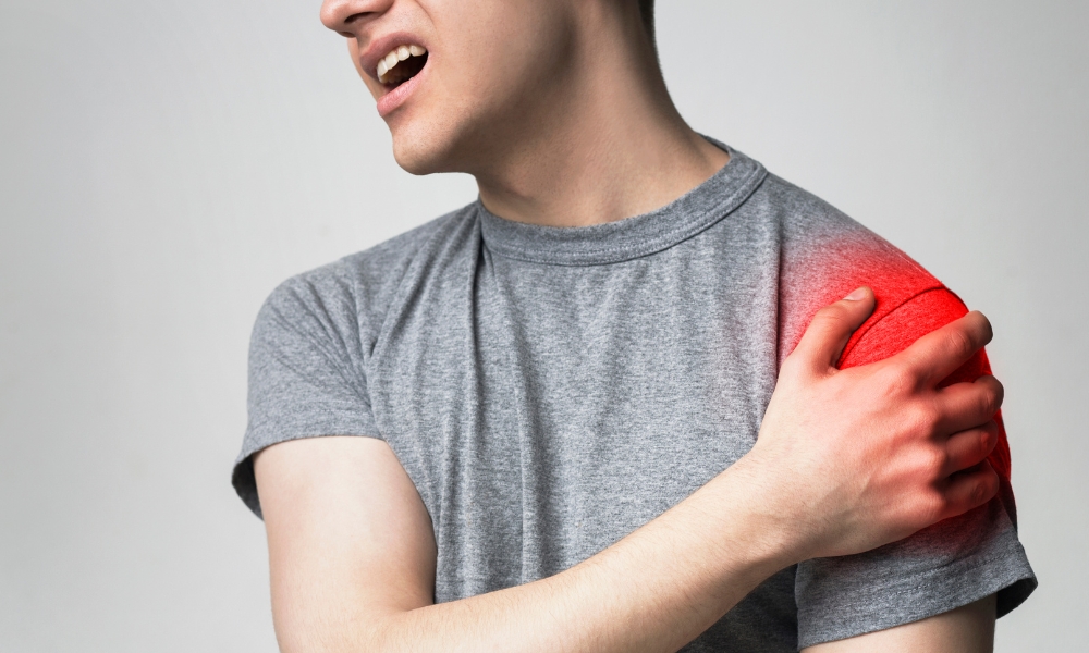 Emergency physician evaluating a patient with sudden left arm pain and chest discomfort